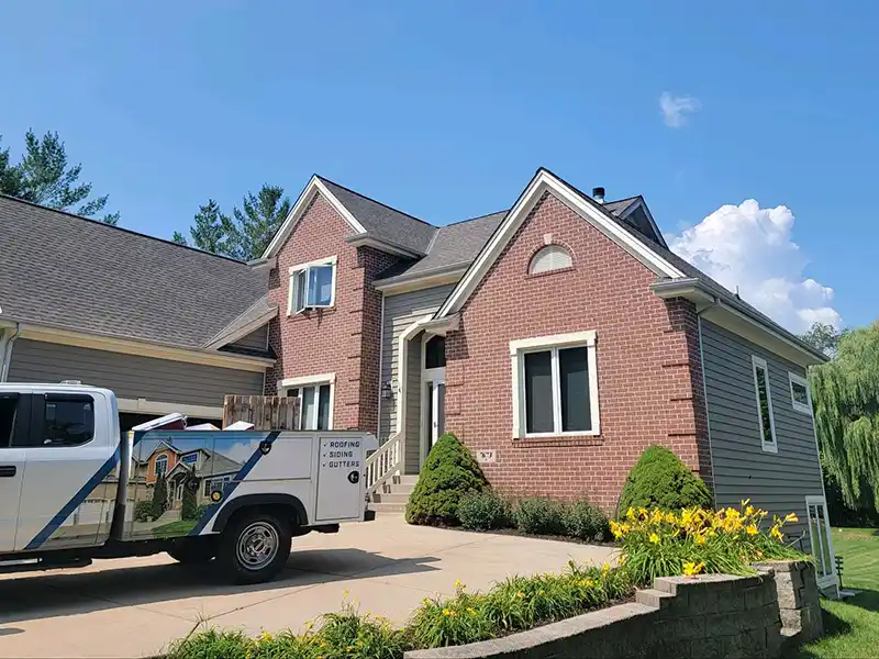 Company truck in front of a home