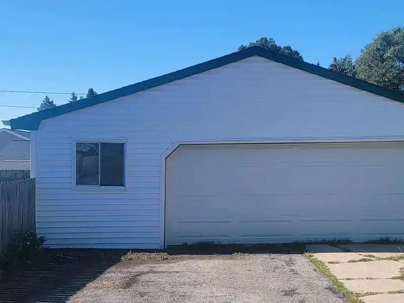 Garage with new white siding